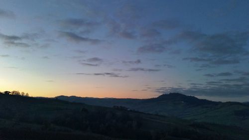 Scenic view of mountains against sky during sunset