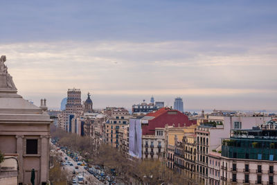 View of city against cloudy sky