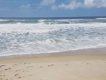 Scenic view of beach against sky