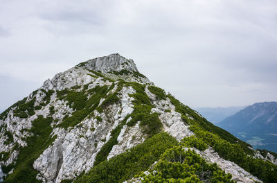 Low angle view of rocks against sky