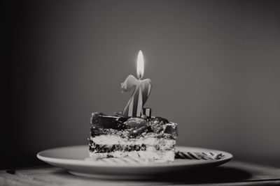 Burning candles on birthday cake