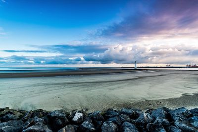 Scenic view of sea against cloudy sky