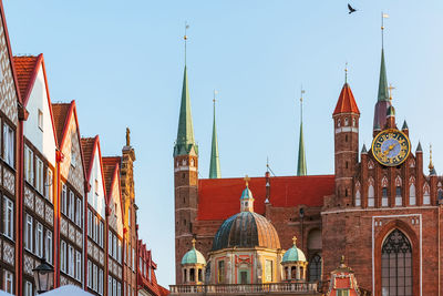 Panoramic view of buildings in city against clear sky