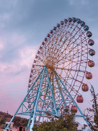 Low angle view of ferris wheel against sky