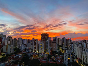 Cityscape against sky during sunset
