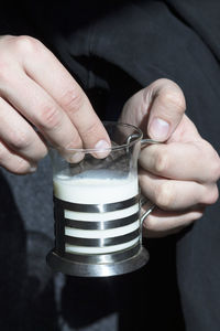 Close-up of hand holding ice cream