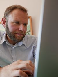 Mid adult man using computer