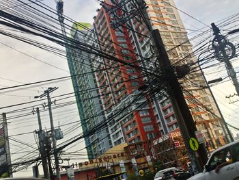 Low angle view of electricity pylon against sky