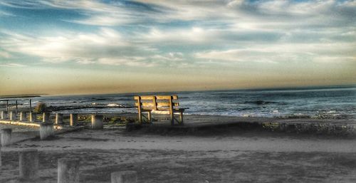 Scenic view of beach against sky during sunset