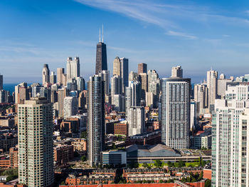 Modern buildings in city against sky