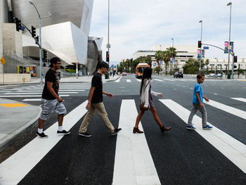 People on road in city