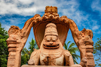 Low angle view of statue against sky