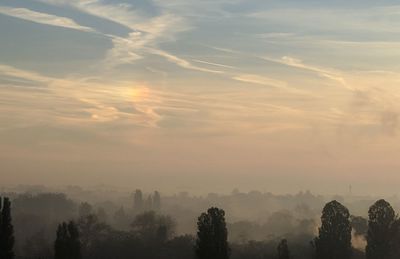 Scenic view of landscape against sky during sunset