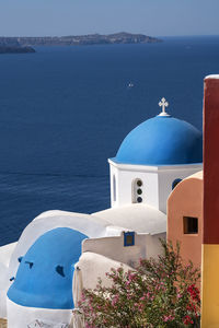 High angle view of church against blue sea