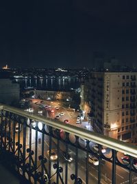 High angle view of illuminated buildings in city at night