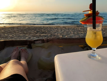 Panoramic shot of drink on beach against sky