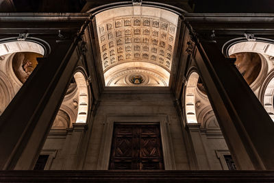 View from below of the entrance of the cathedral of sant'alessandro in bergamo illuminated at night
