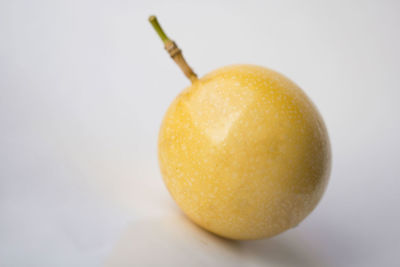 Close-up of fruit over white background