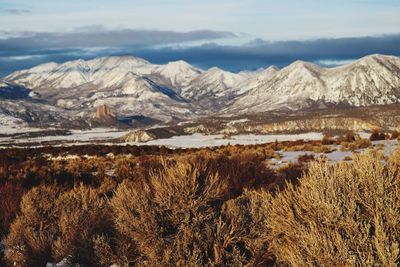 Scenic view of snowcapped mountains against sky