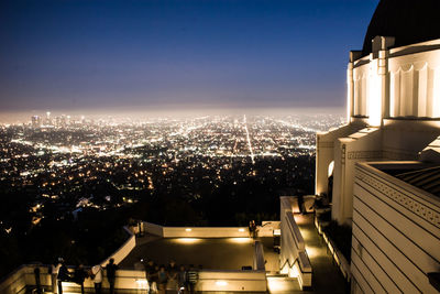 High angle view of city buildings at night