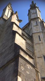 Low angle view of building against blue sky