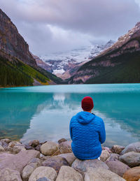 Rear view of woman looking at lake