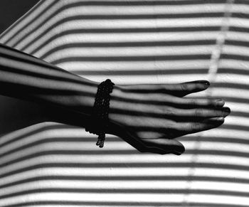 Close-up of hand on window