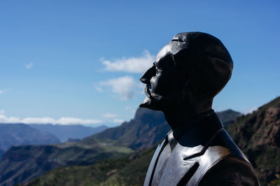 Close-up of statue against mountain