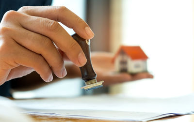 Close-up of man working on table