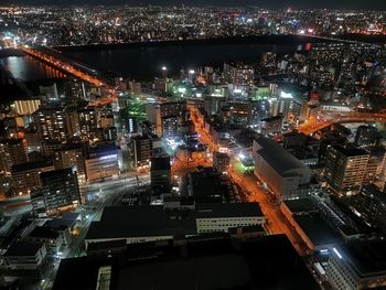 High angle view of illuminated buildings in city at night