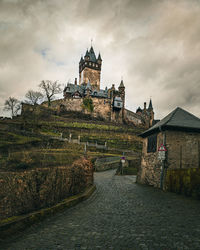 Castle against cloudy sky