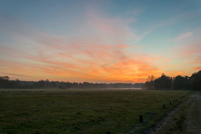 Scenic view of landscape at sunset