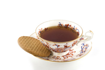 Close-up of tea cup against white background
