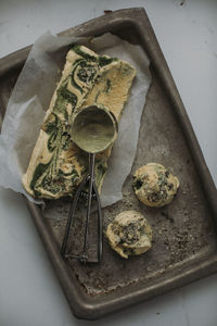 Homemade ice cream and ice cream scoop on tray