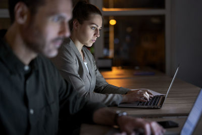 Business people working late in office