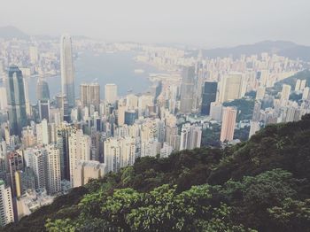 High angle view of victoria harbour amidst skyscrapers