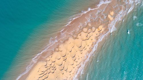 Aerial view of waves on beach