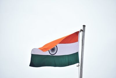 Low angle view of flag against clear sky