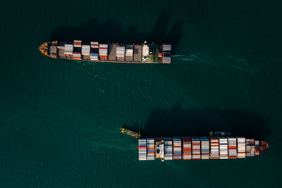 Aerial top view two container cargo ship in import export business service and industry 
