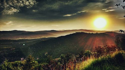 Scenic view of landscape against sky during sunset
