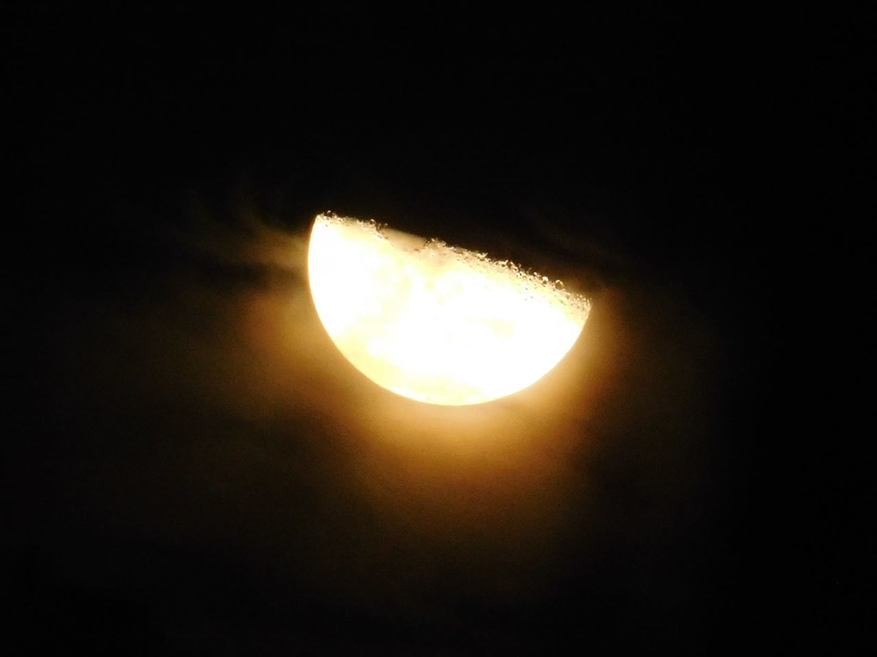 LOW ANGLE VIEW OF ILLUMINATED LAMP AGAINST SKY IN SUNLIGHT