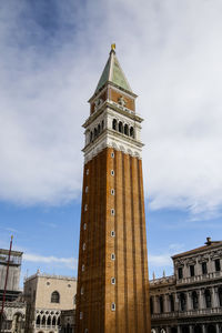 Low angle view of clock tower against sky