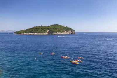 Scenic view of sea against clear blue sky