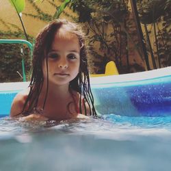 Portrait of girl swimming in pool