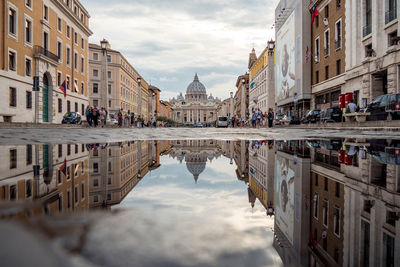 Reflection of buildings in puddle