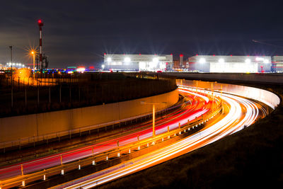High angle view of light trails on road at night