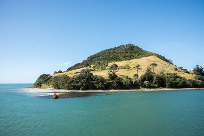 Scenic view of sea against clear blue sky