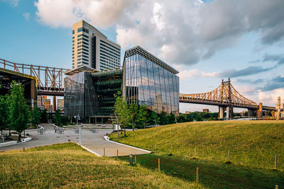 View of modern building against cloudy sky