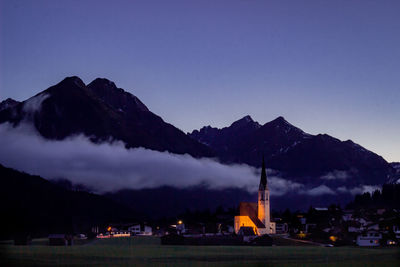 Scenic view of silhouette mountains against sky at dusk