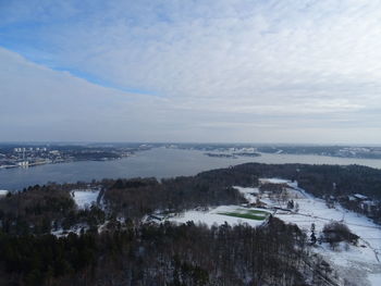 Scenic view of river against sky during winter